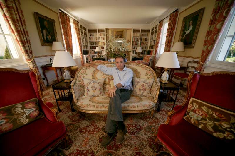 Jean-Philippe Delmas is photographed in the sitting room at La Mission Haut-Brion. The understated elegance and sophistication of the wine are picked up in the portraits that nod to the history of the estate.